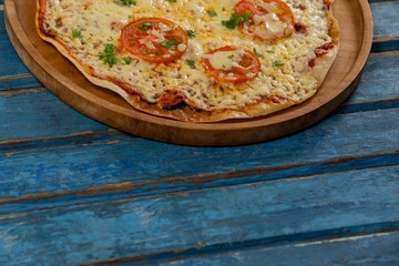 Delicious italian pizza served on pizza tray
