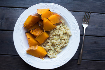a dish of cooked pumpkin and quinoa