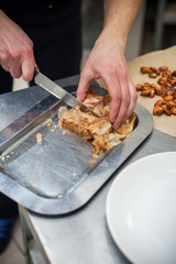 Cropped shot of male hands with strudel.