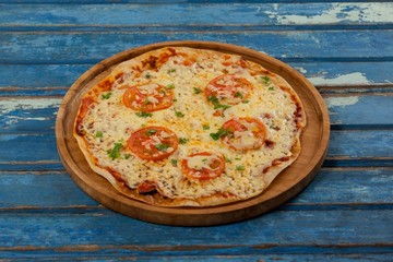Delicious italian pizza served on pizza tray