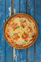 Delicious italian pizza served on pizza tray