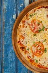 Delicious italian pizza served on pizza tray