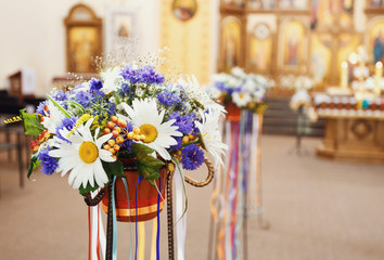 beautiful scenery of flowers standing in the church