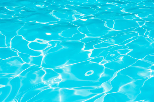 Blue and bright ripple water and surface in swimming pool