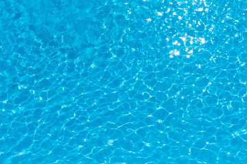 Obraz na płótnie Canvas Beautiful ripple wave and blue water surface in swimming pool