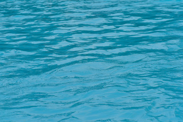 Blue water surface and ripple wave in pool
