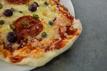 Close-up of pizza served on a pizza tray