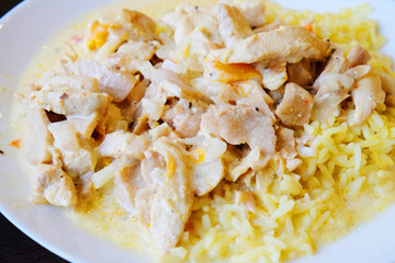 rice with chicken and mushrooms in cream sauce closeup