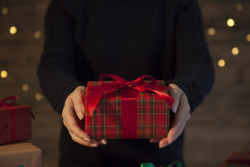 Women are handing Christmas gifts