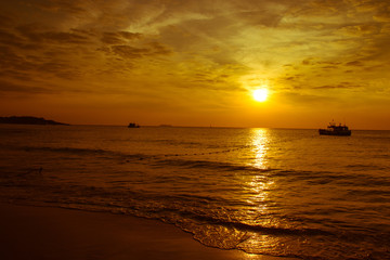 Sunrise on the beach with boat, Vacation concept