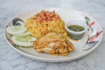 Muslim yellow rice with chicken,(Thai-Muslim version of Indian , with fragrant yellow rice. It's usually eaten with chicken)