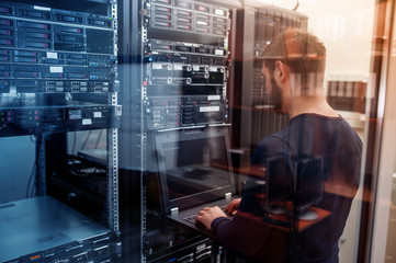 Fototapeta network engineer working in server room obraz