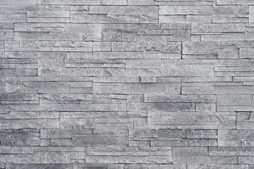 Fond de mur en pierre grise. Les carreaux de pierre empilés sont souvent utilisés dans les décors de décoration d& 39 intérieur comme mur d& 39 accent. Utilisez cette texture grise dans la conception graphique pour créer un fond d& 39 écran, un arrière-pl