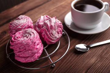 Black coffee and pink zephyr. marshmallow. Sweet pink marshmallow - zephyr and cup of Coffee. Christmas Still Life. Winter drink theme. Romance. Provencal still life. Good morning