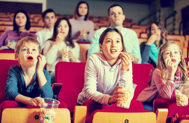Number of people enjoying film screening and popcorn