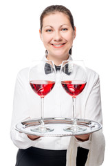 The waitress gives a delicious red wine, portrait on a white bac