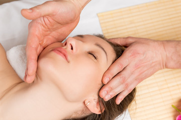 Obraz na płótnie Canvas stroking massage of the face, hands beautician male closeup