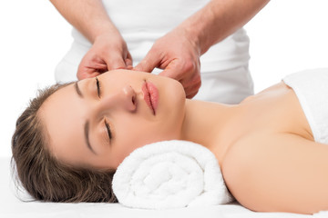 Obraz na płótnie Canvas skin massage the hands of an experienced cosmetologist, masseur