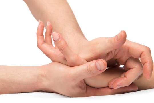 kneading massage hands, close-up shot on a white background