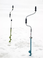 Small hand operated ice auger used in ice fishing