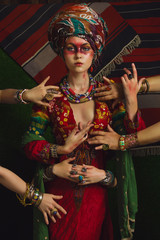 Stylized vintage portrait of young woman in ethno style