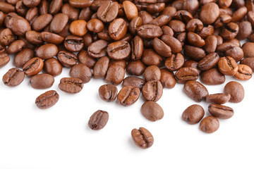 roasted coffee beans isolated in white background. Roasted coffee beans background close up. Coffee beans pile from top on white background with copy space for text. Good morning.