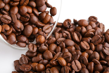 roasted coffee beans isolated in white background. Roasted coffee beans background close up. Coffee beans pile from top on white background with copy space for text. Good morning.