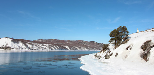 white ice of Lake Baikal and the blue waters of the Angara River,Siberia