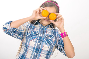 Girl and tangerines. cheerful teen girl holding oranges near the face. Healthy girl with vitamins in the form of citrus fruits. healthy diet for teenagers, vitamin deficiency in the spring,
