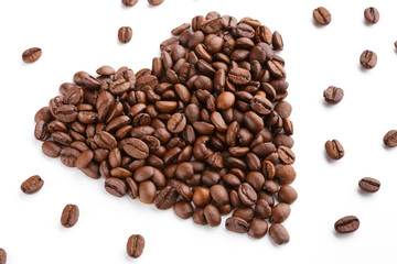 Naklejka premium roasted coffee beans isolated in white background. Roasted coffee beans background close up. Coffee beans pile from top on white background with copy space for text. Good morning.