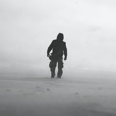 Black and white photo of man in snow storm