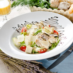 Caesar salad with fried chicken breast