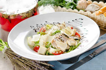 Caesar salad with fried chicken breast