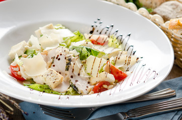 Caesar salad with fried chicken breast