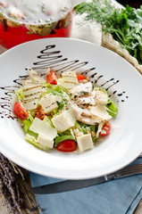 Caesar salad with fried chicken breast