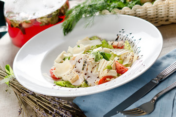 Caesar salad with fried chicken breast