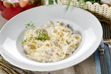 tagliatelle carbonara with bacon, cream sauce and cheese Parmigi