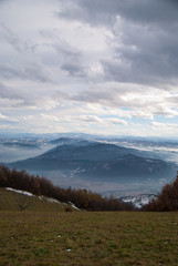 Panoramic view of the mountains covered in snow and fog