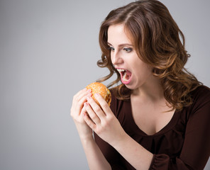 Young woman with hamburger