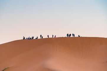 Fototapeta na wymiar group of people in desert 