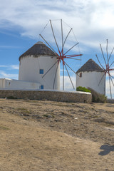 Fototapeta na wymiar The famous windmills at the port of Mykonos, Cyclades, Greece du
