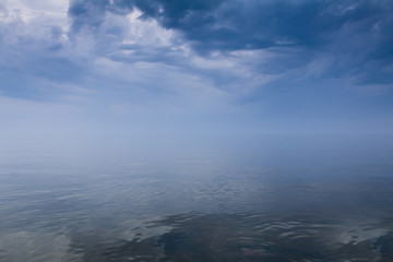 Stormy sky over calm sea