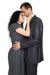 romantic couple hugging, dressed in black suit, isolated white