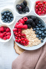 Big bowl of oat granola with berries. Breakfast concept.
