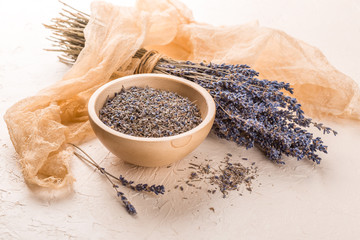 Wellness care products with lavender seeds in a bowl