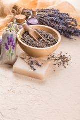 Wellness care products with lavender seeds in a bowl