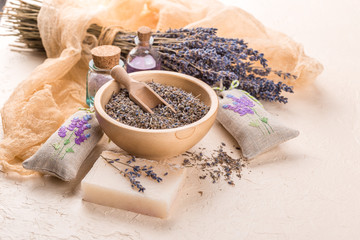 Wellness care products with lavender seeds in a bowl