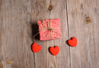 Heart on a wooden background and gift box