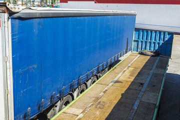 Fototapeta na wymiar Containers and trailers in the port of Barcelona, Spain