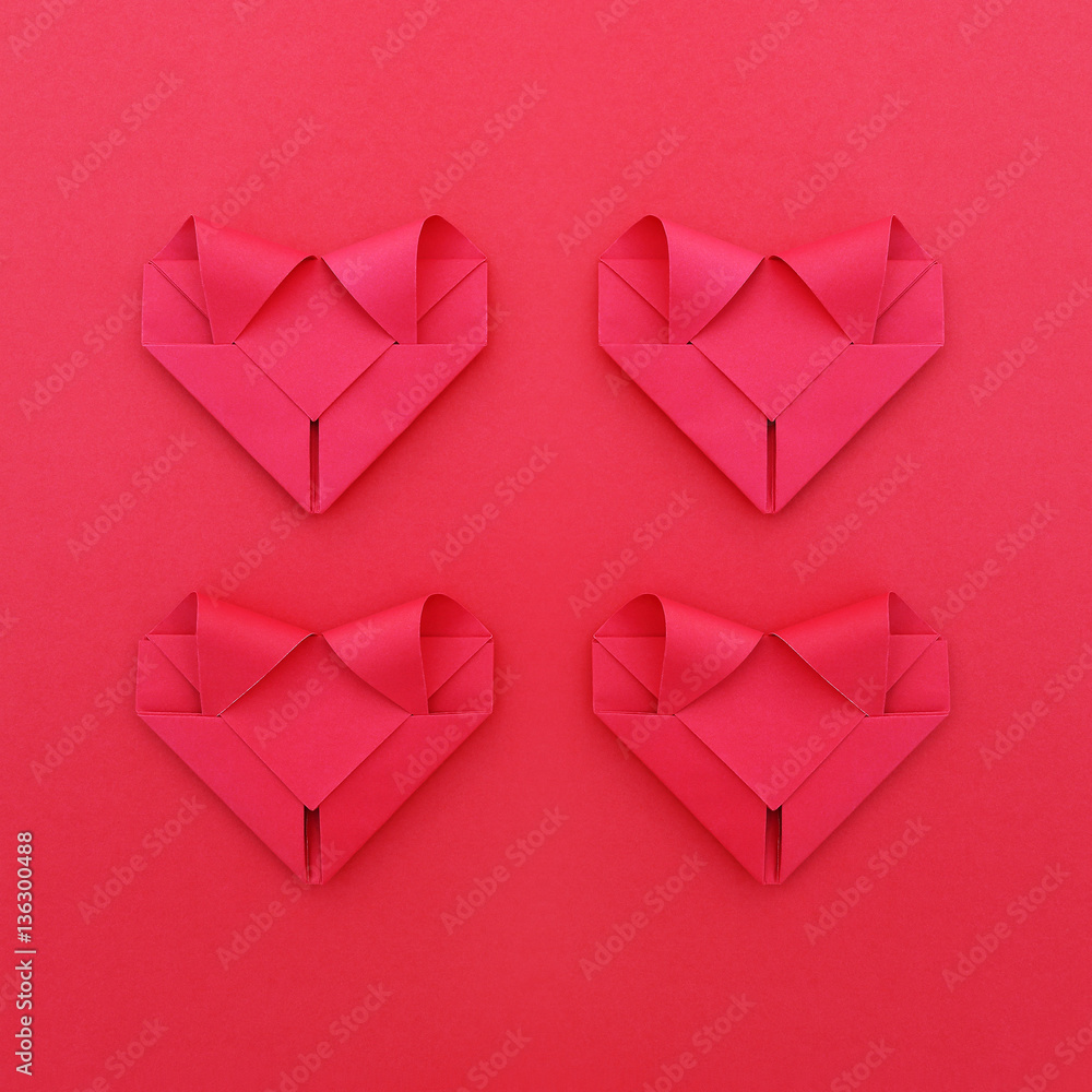 Poster four folding red paper hearts on red for valentine pattern and b